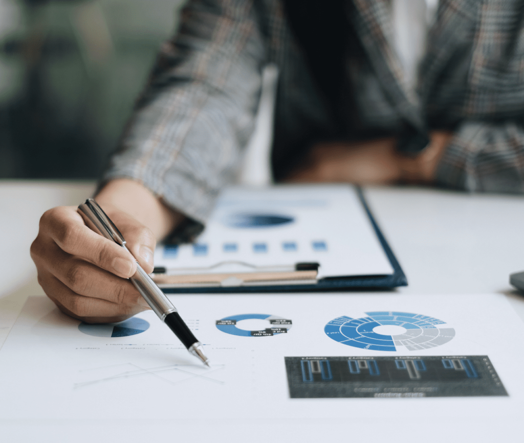 Close up of man reviewing a print out of evidence data and chart analytics intently