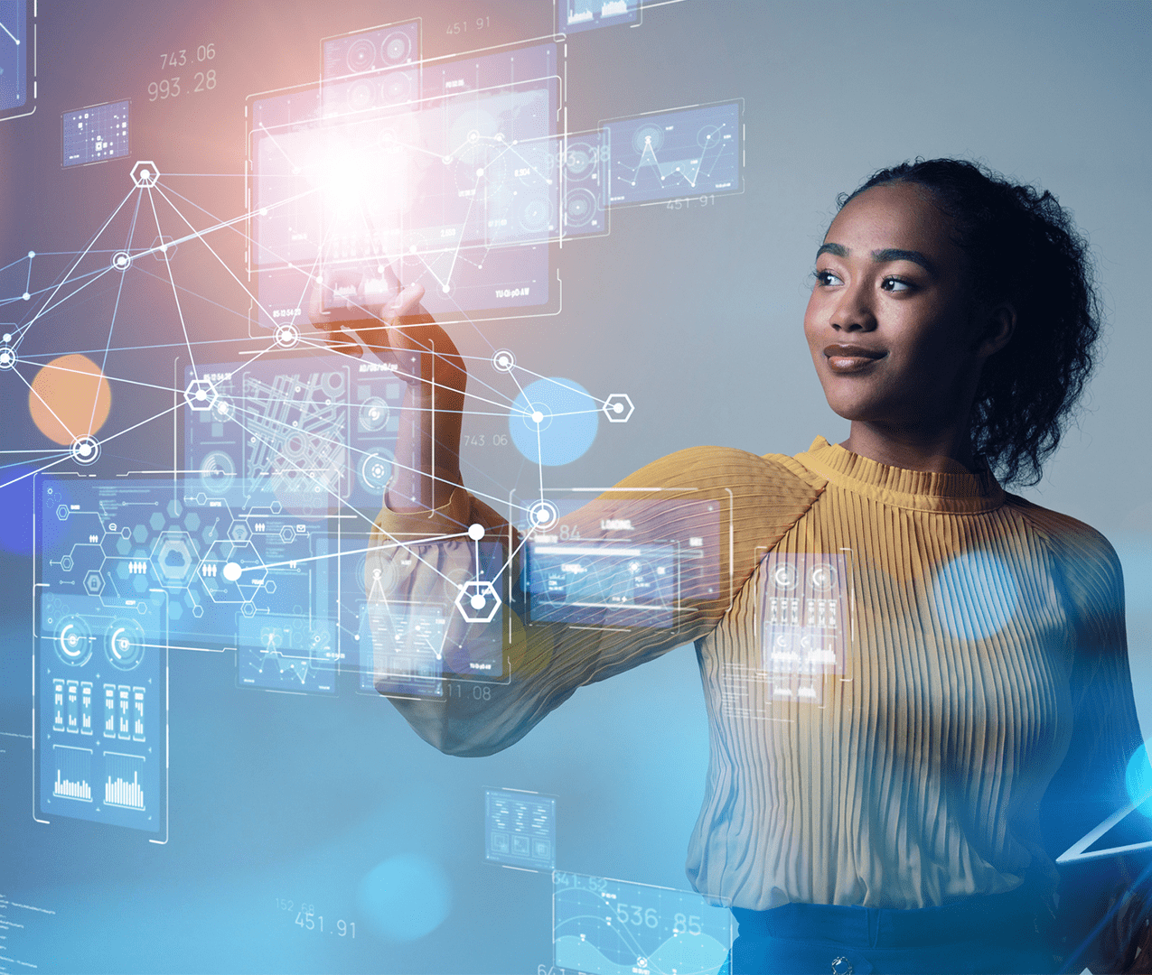 Confident woman reviews several screens of analytics and data points and makes a selection by touching one of the screens