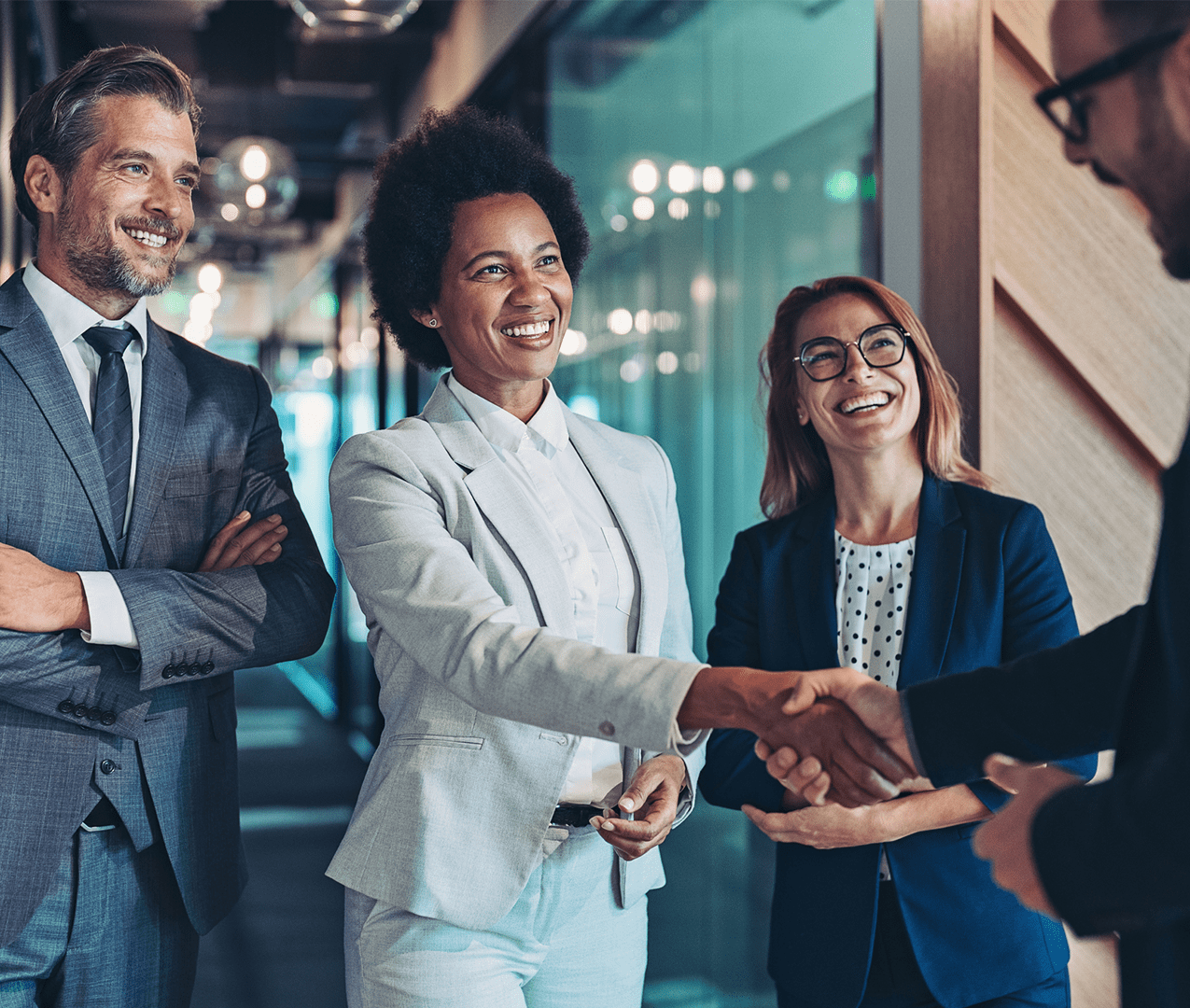 Business woman and her two colleagues meet their business partner for the first time.