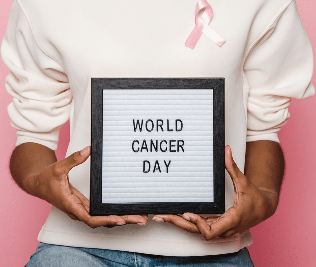 Person holding sign that says 