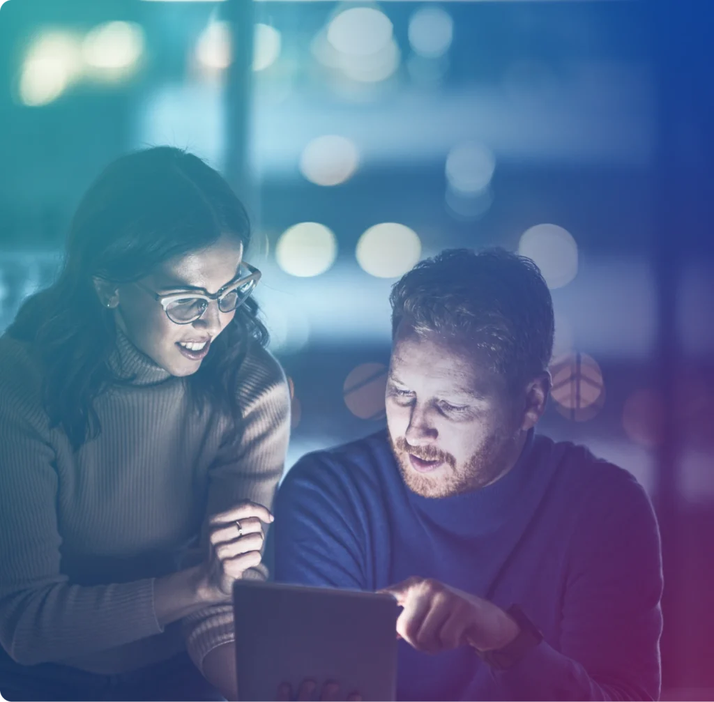 Man and Woman looking at tablet